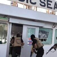 Screen capture from video of Houthi gunmen storming the bridge of the Iberian-flagged cargo ship Magic Seas before they sank it July 8, 2025. (Houthi Media Office)
